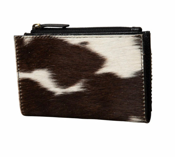 Black and white cowhide leather pouch on a white background