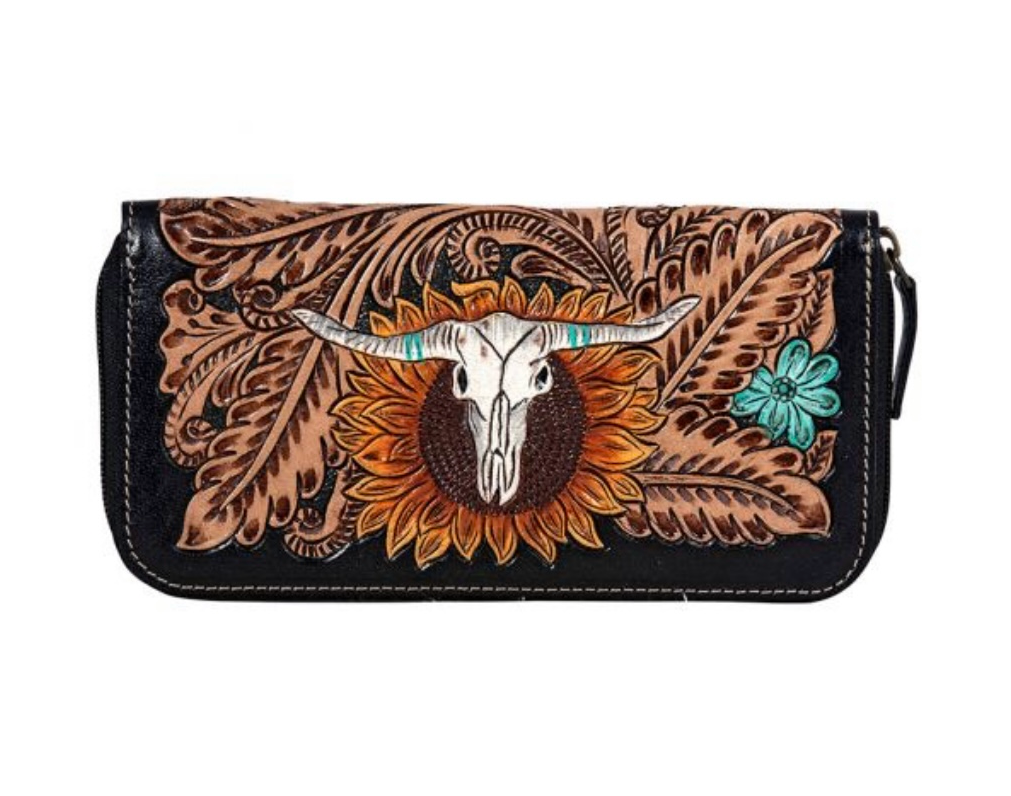 A tooled leather wallet featuring a steer design with a brown and black color scheme.
